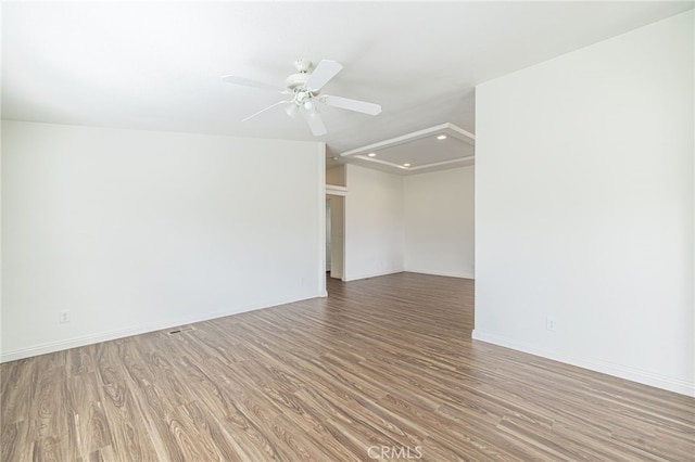 spare room featuring ceiling fan and hardwood / wood-style floors