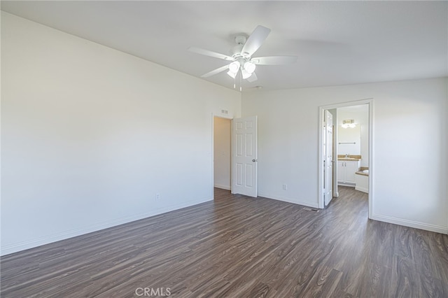 unfurnished room with dark wood-type flooring and ceiling fan