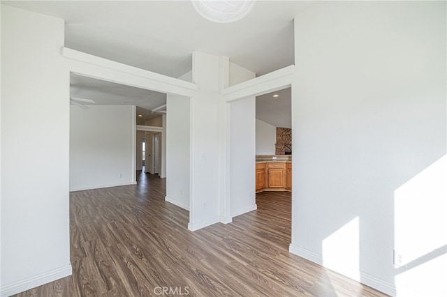 spare room featuring dark wood-type flooring