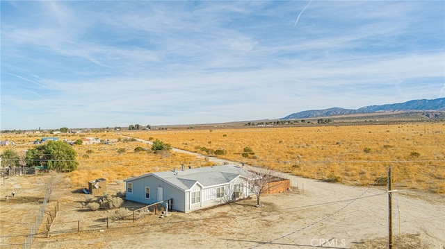 bird's eye view featuring a rural view and a mountain view