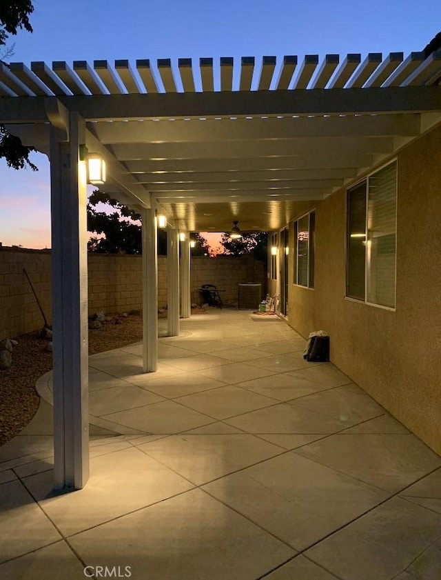 view of patio terrace at dusk