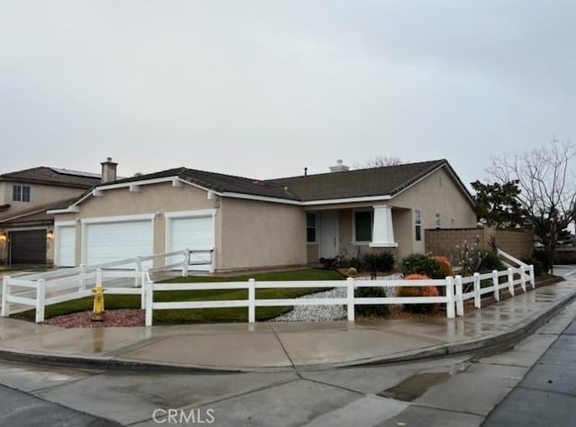 single story home with a garage