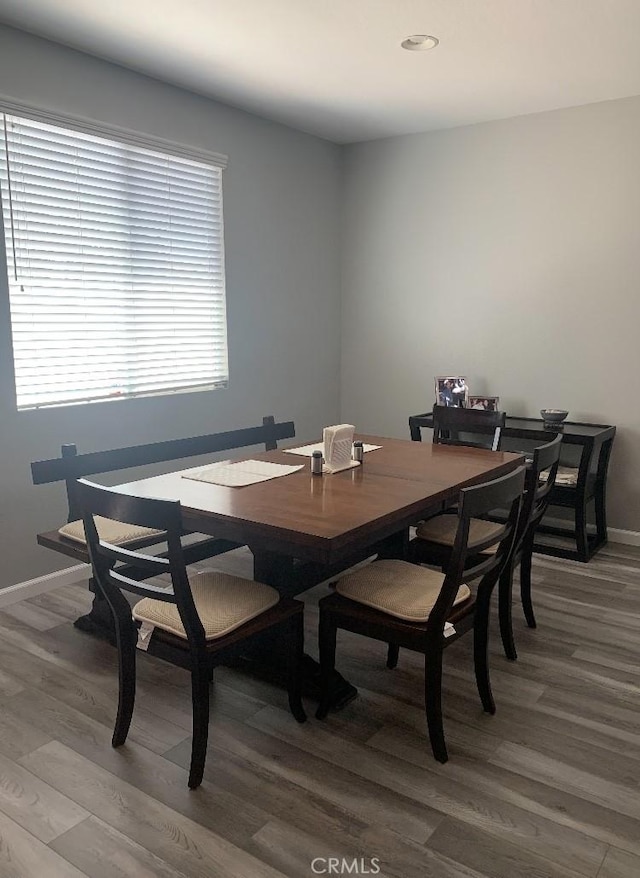 dining space featuring hardwood / wood-style flooring