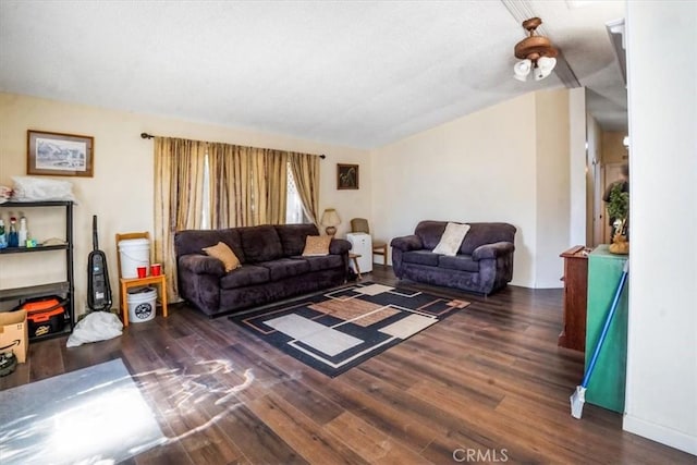 living room featuring dark wood-type flooring