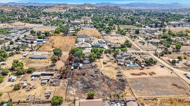 birds eye view of property featuring a mountain view