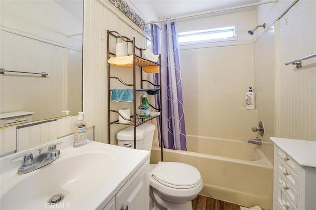 full bathroom featuring vanity, shower / tub combo, hardwood / wood-style floors, and toilet