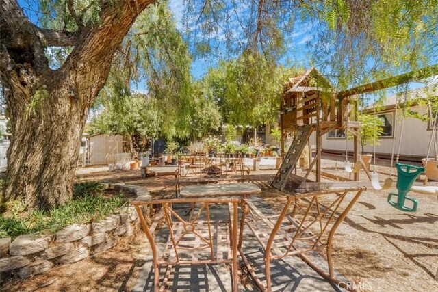 view of patio featuring a playground