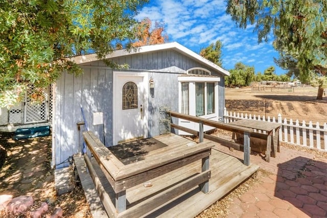 exterior space with an outdoor structure and a patio area