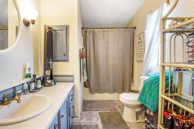 full bathroom featuring vanity, a wealth of natural light, shower / bath combination with curtain, and toilet