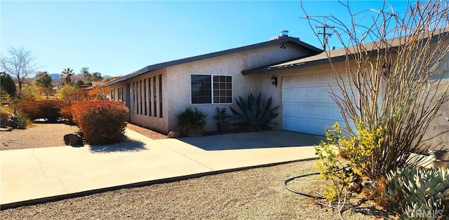 view of property exterior featuring a garage