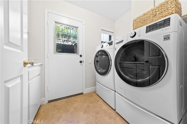 laundry room featuring washing machine and dryer