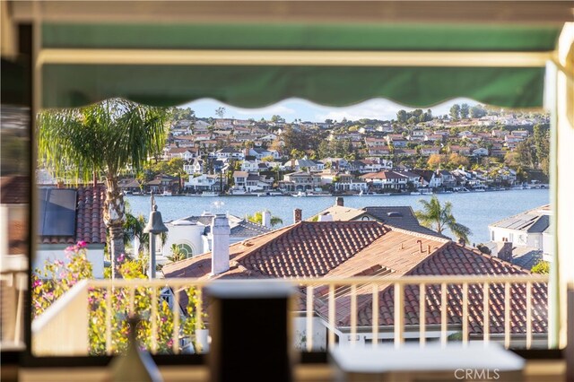 balcony featuring a water view