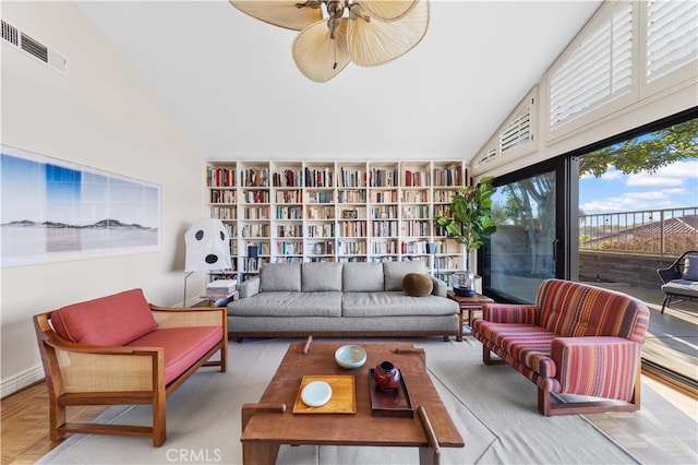 interior space featuring lofted ceiling and ceiling fan