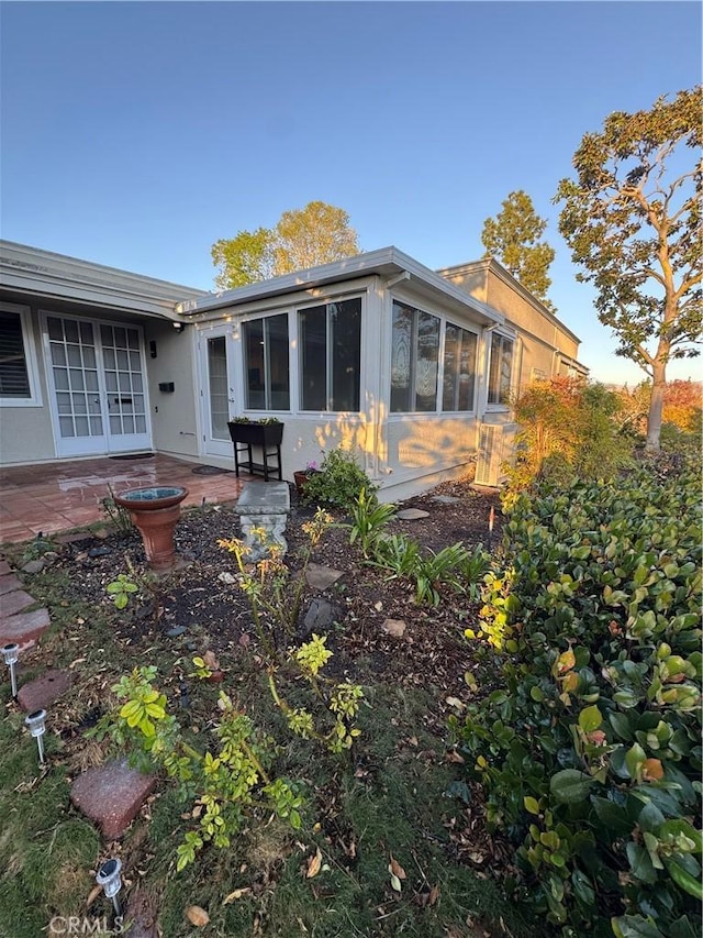 back of property with a patio