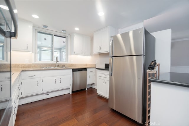 394 Avenida Castilla Unit F, Laguna Woods, CA 92637 - kitchen featuring appliances with stainless steel finishes, white cabinets, dark wood-style floors, and recessed lighting