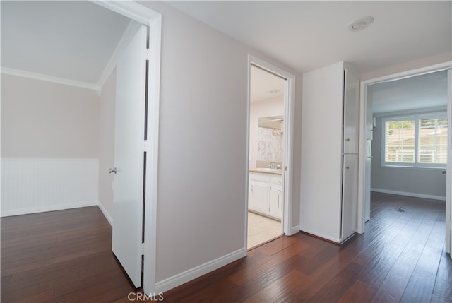 394 Avenida Castilla Unit F, Laguna Woods, CA 92637 - corridor featuring dark wood-style flooring and ornamental molding