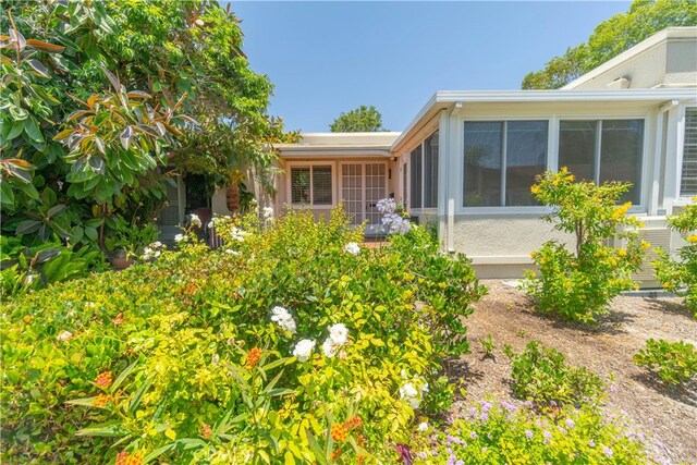 394 Avenida Castilla Unit F, Laguna Woods, CA 92637 - back of house featuring a sunroom