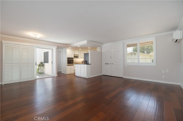 394 Avenida Castilla Unit F, Laguna Woods, CA 92637 - unfurnished living room with a wall mounted AC, dark wood finished floors, and ornamental molding