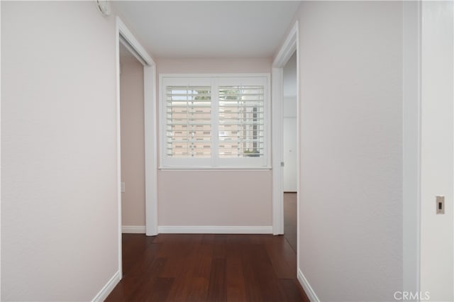 394 Avenida Castilla Unit F, Laguna Woods, CA 92637 - hallway with dark wood-style flooring and baseboards