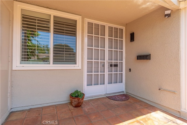 394 Avenida Castilla Unit F, Laguna Woods, CA 92637 - view of exterior entry featuring stucco siding
