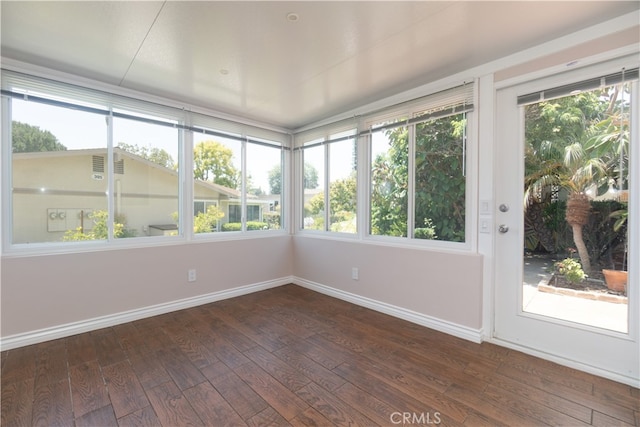394 Avenida Castilla Unit F, Laguna Woods, CA 92637 - unfurnished sunroom featuring wood finished floors and baseboards