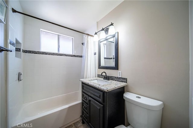 full bathroom featuring vanity, shower / bath combination with curtain, and toilet