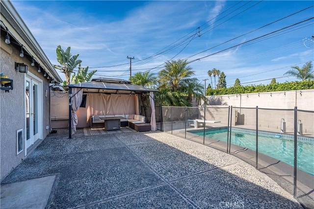 view of swimming pool with a gazebo, an outdoor hangout area, and a patio