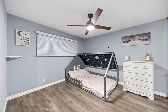 bedroom featuring ceiling fan and wood-type flooring