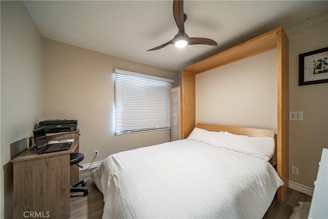 bedroom with dark wood-type flooring and ceiling fan