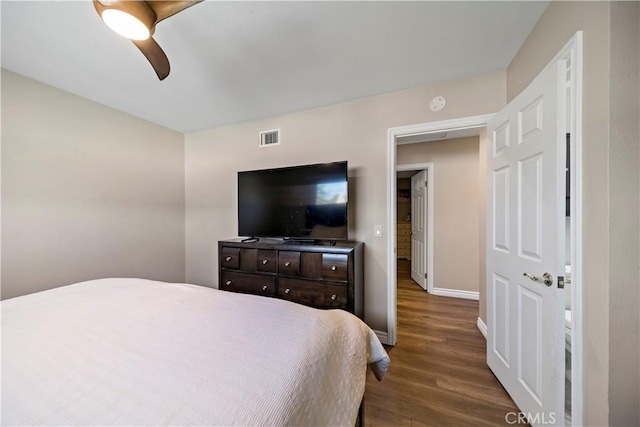 bedroom featuring dark wood-type flooring and ceiling fan