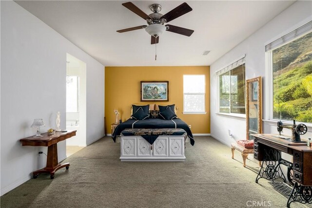 bedroom with light colored carpet and ceiling fan