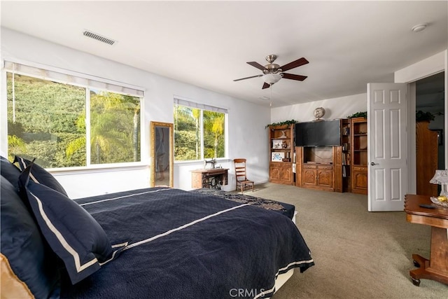 carpeted bedroom featuring ceiling fan