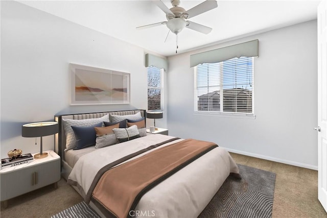 bedroom with baseboards, carpet floors, and ceiling fan