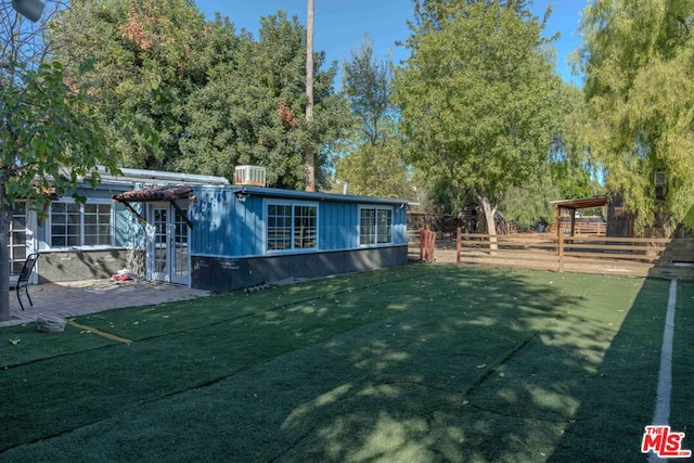 exterior space with french doors and a patio area