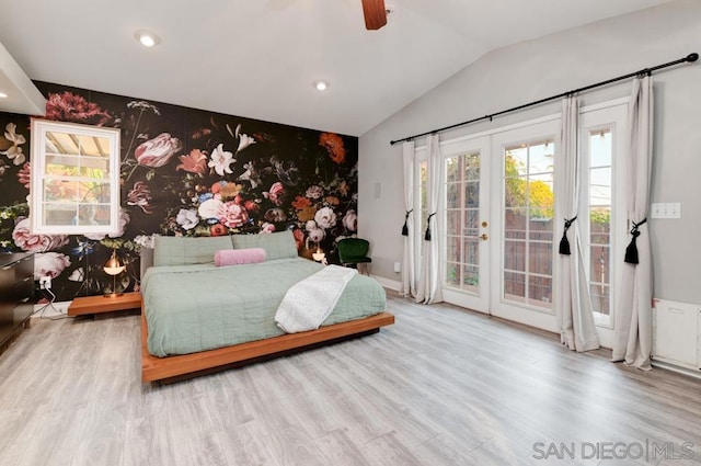 bedroom featuring french doors, wood-type flooring, vaulted ceiling, ceiling fan, and access to exterior