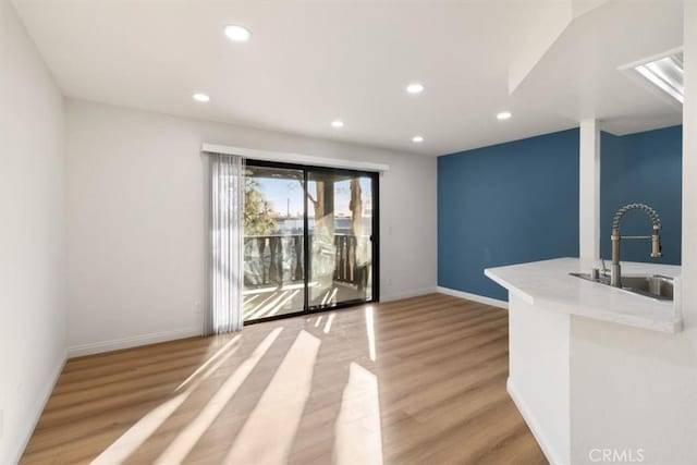 interior space featuring light hardwood / wood-style floors and sink