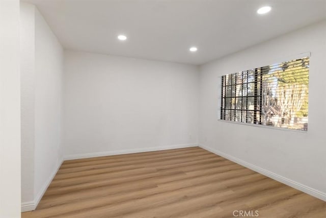 empty room featuring wood-type flooring