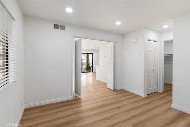 hall with light wood-type flooring