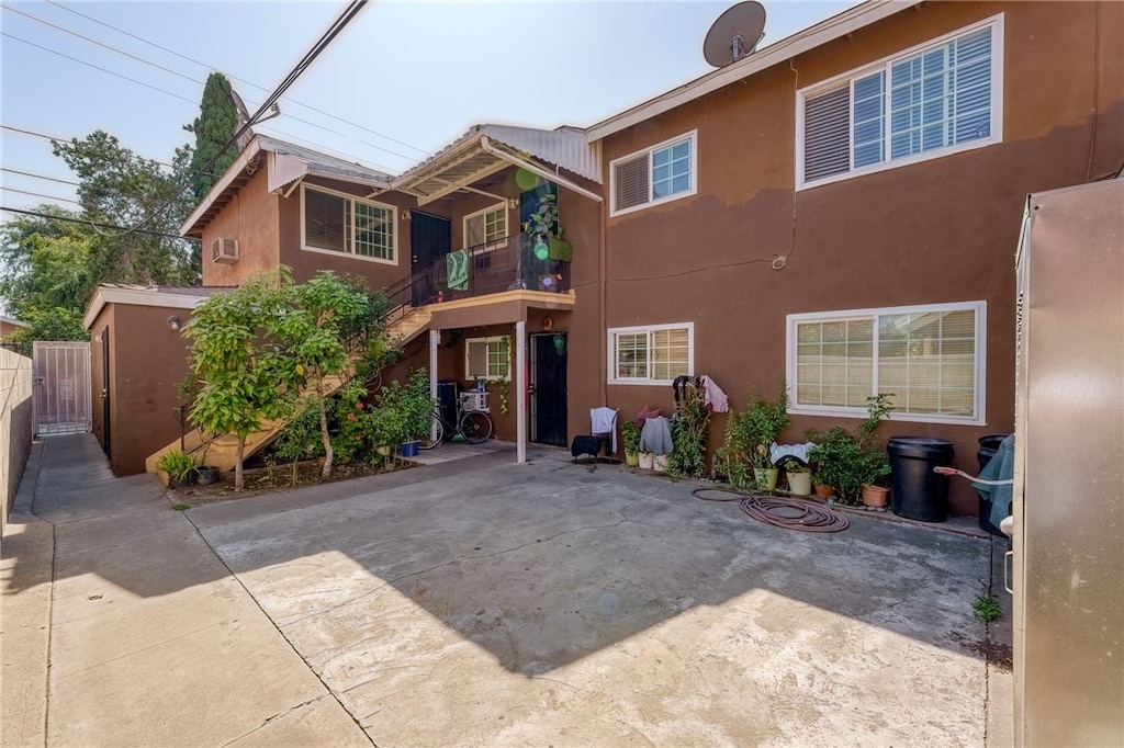 rear view of property featuring a patio