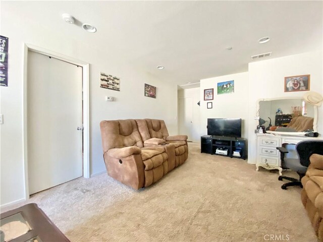 living room featuring light colored carpet