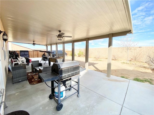 view of patio / terrace with ceiling fan, an outdoor living space, and area for grilling