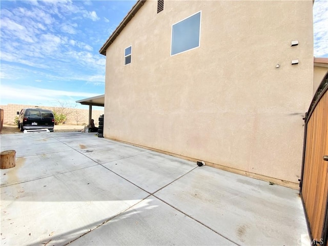 view of home's exterior featuring a patio area