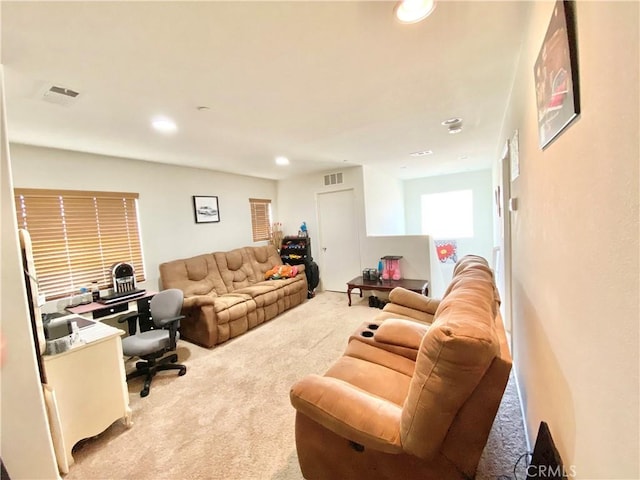 living room featuring light carpet