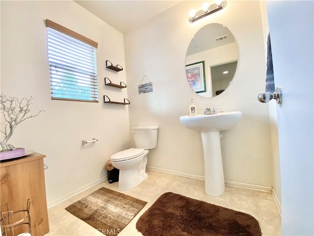 bathroom with sink, tile patterned floors, and toilet