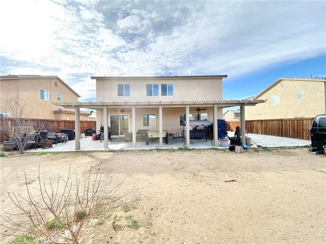 rear view of house with a pergola, a patio, and ceiling fan