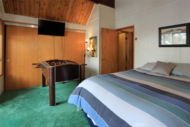 bedroom featuring vaulted ceiling, wooden ceiling, and carpet