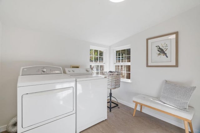 clothes washing area featuring washer and dryer