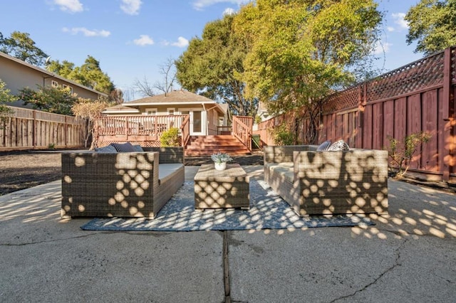 view of patio featuring a wooden deck and an outdoor hangout area