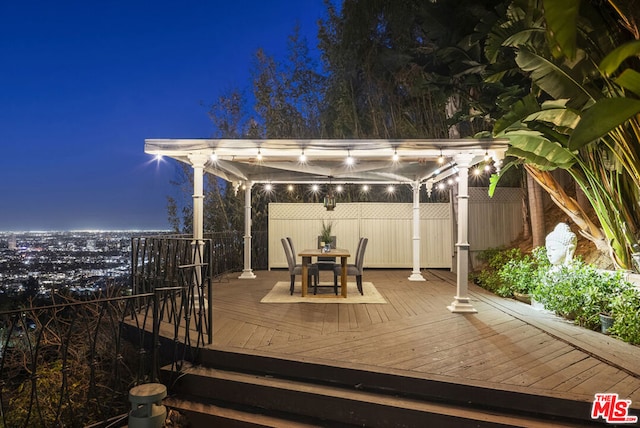 deck at night with a pergola