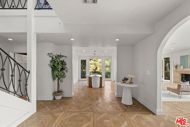 foyer entrance with light parquet flooring